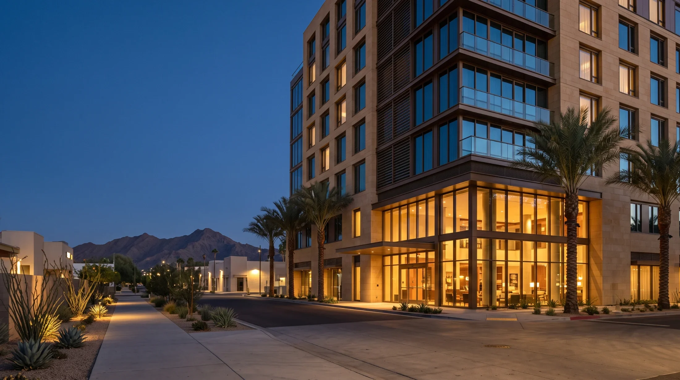 Downtown Phoenix towers at blue hour with South Mountain behind